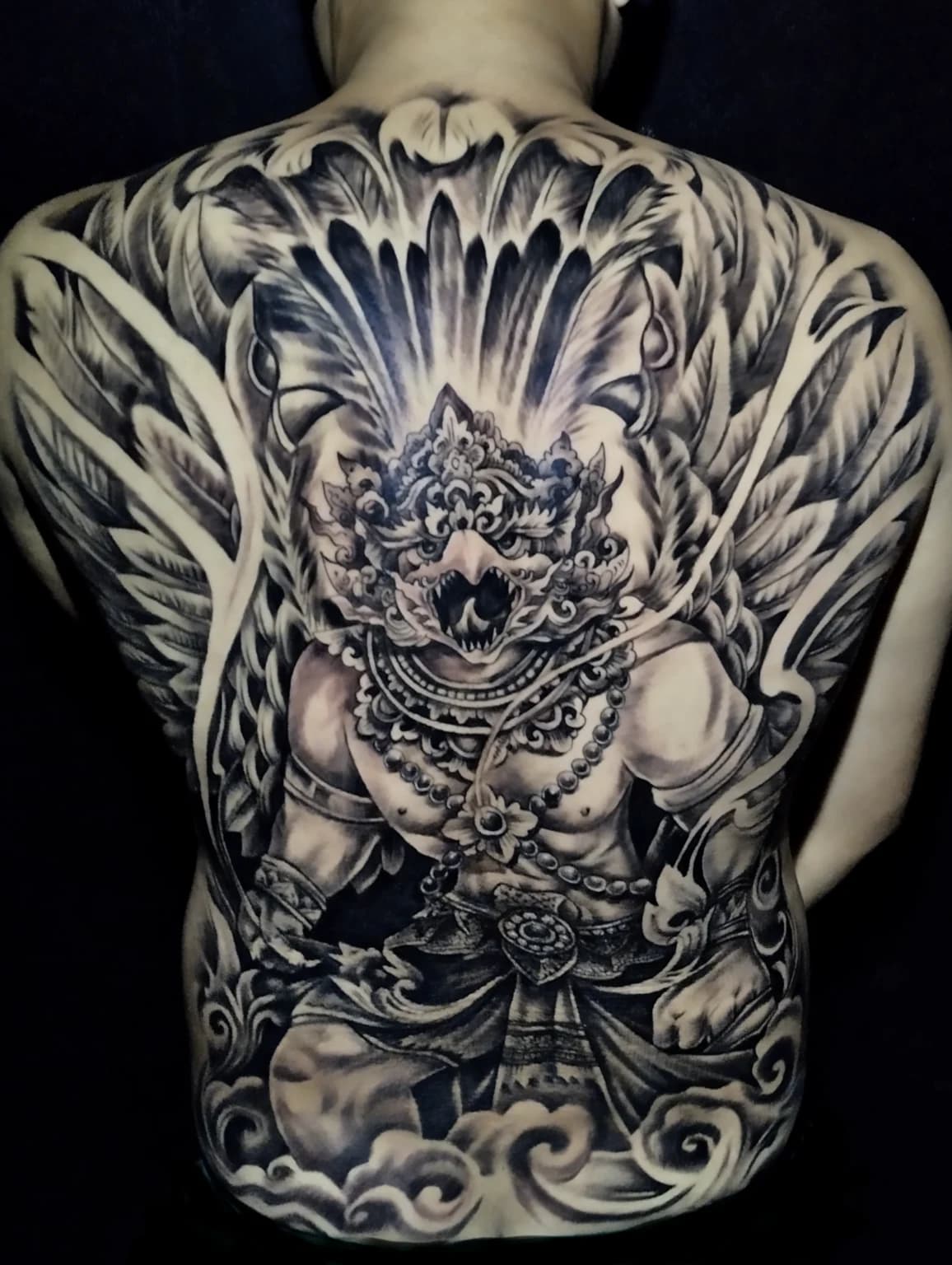 Full-back blackwork tattoo