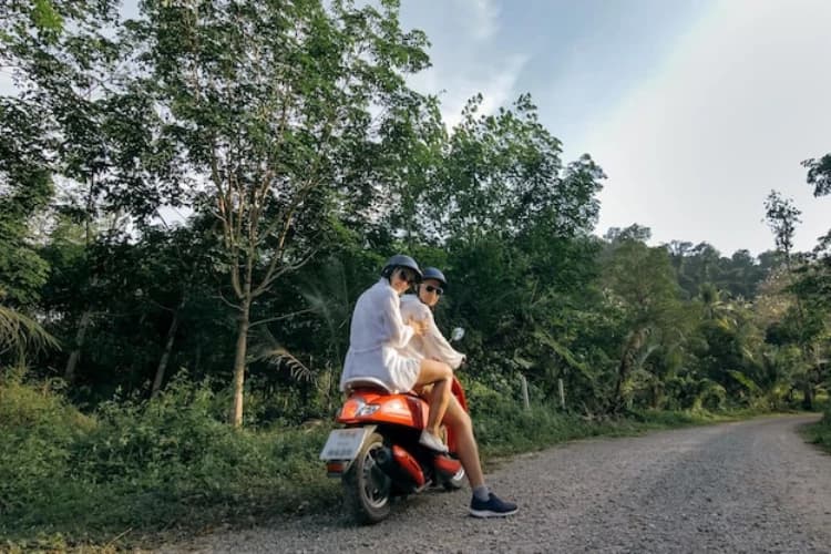 Scooter rider on a Bali route