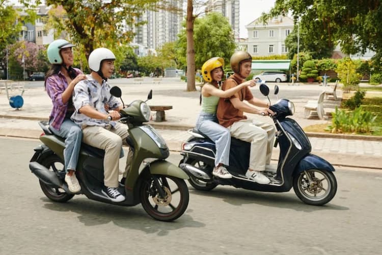 Friends riding scooters together